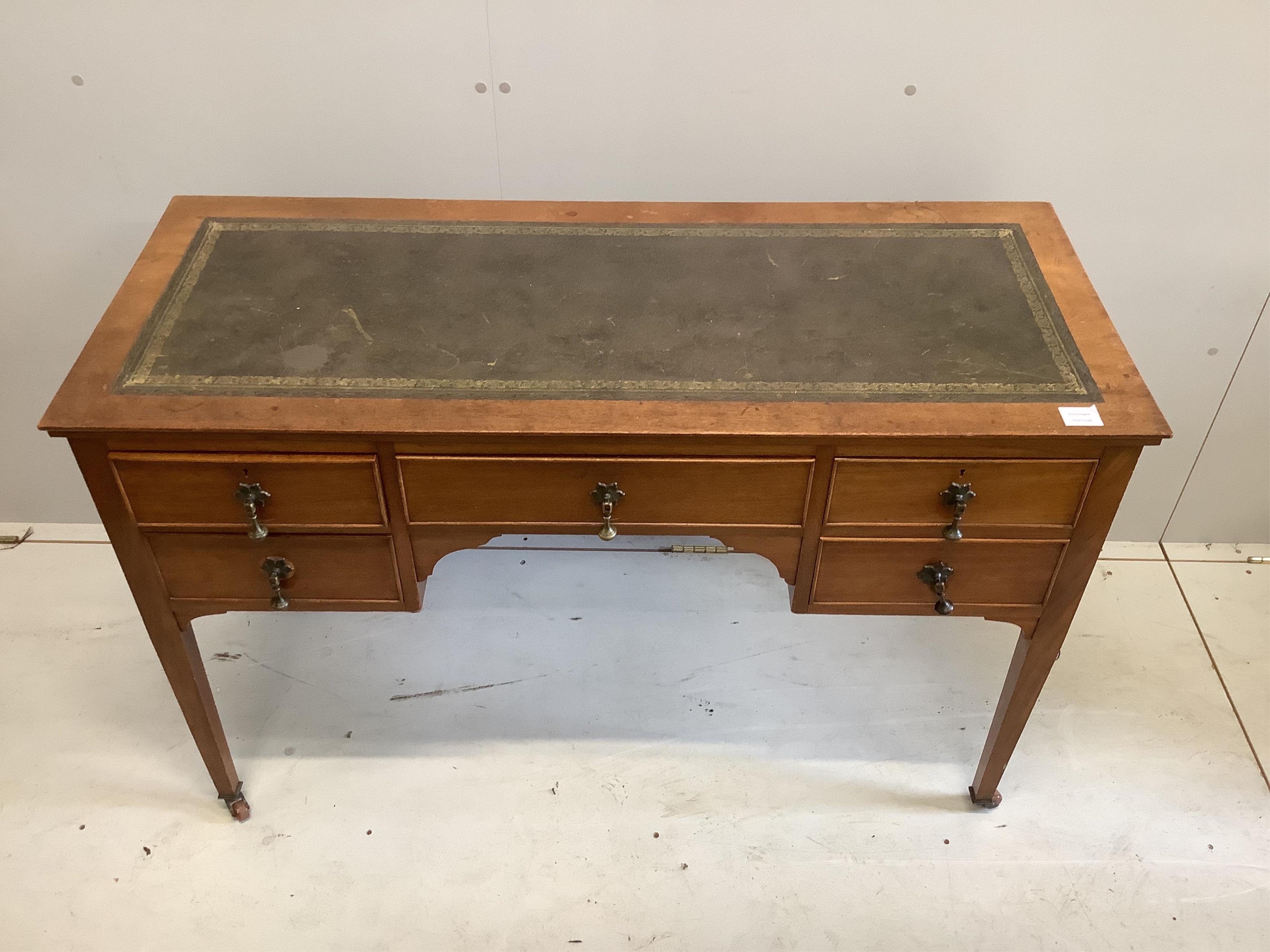 An early 20th century mahogany kneehole writing table, width 122cm, depth 50cm, height 78cm. Condition - fair